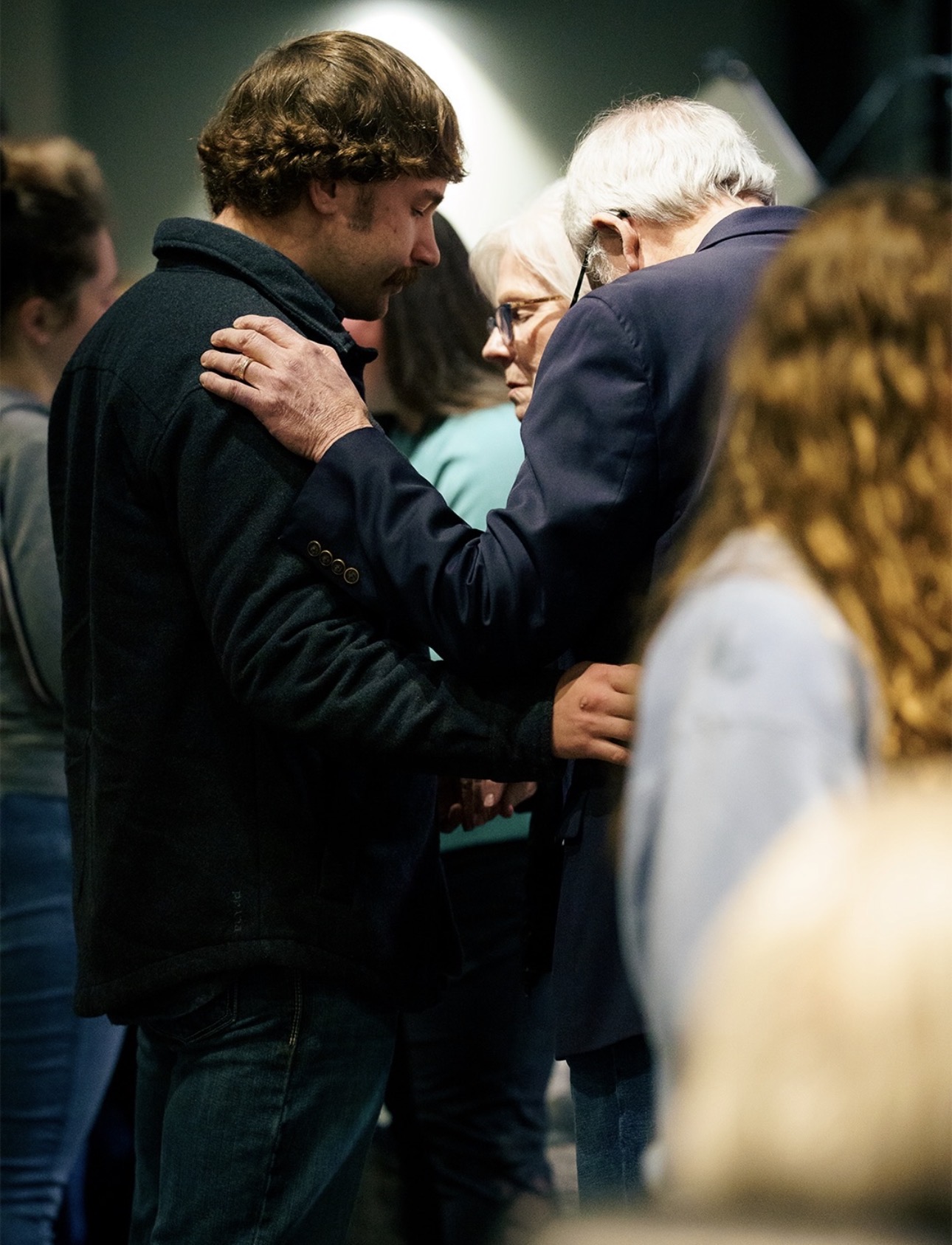 Leaders praying together